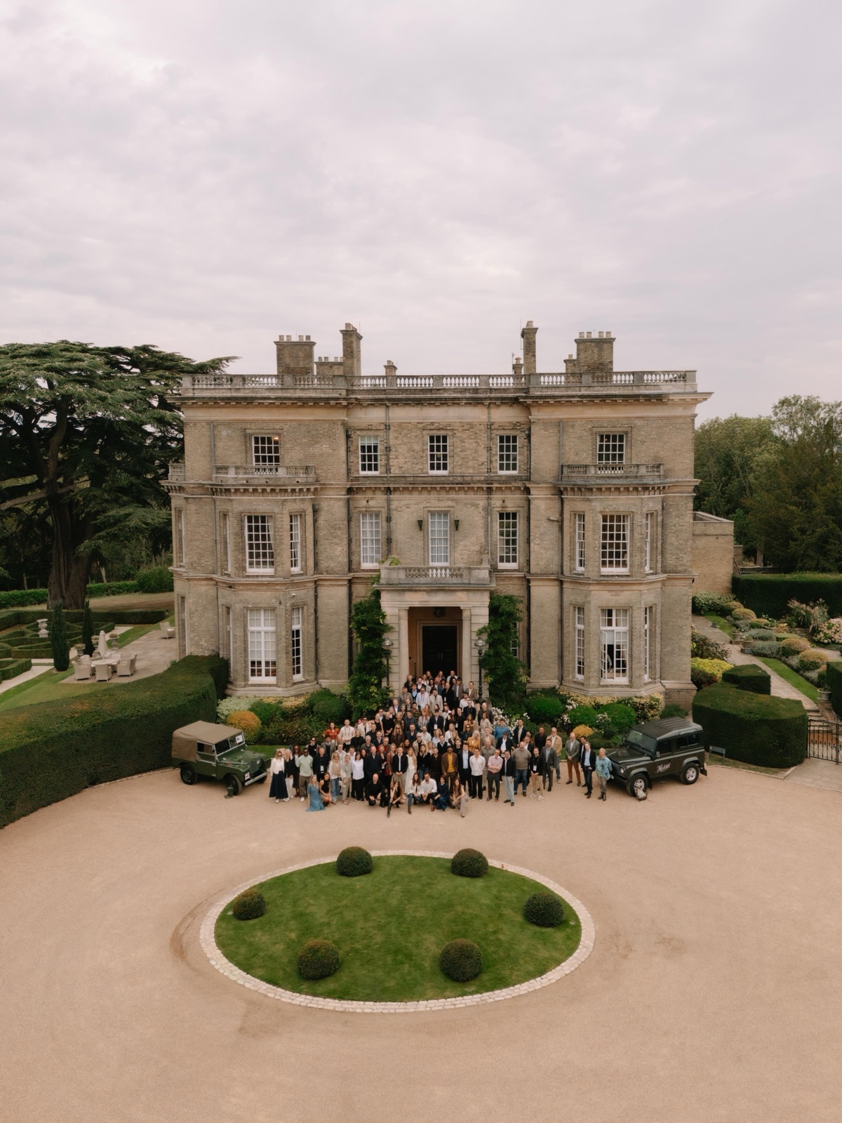 The one hundred guests of The Hedsor Hundred 2026 gathered before Hedsor House, Buckinghamshire, seen from above