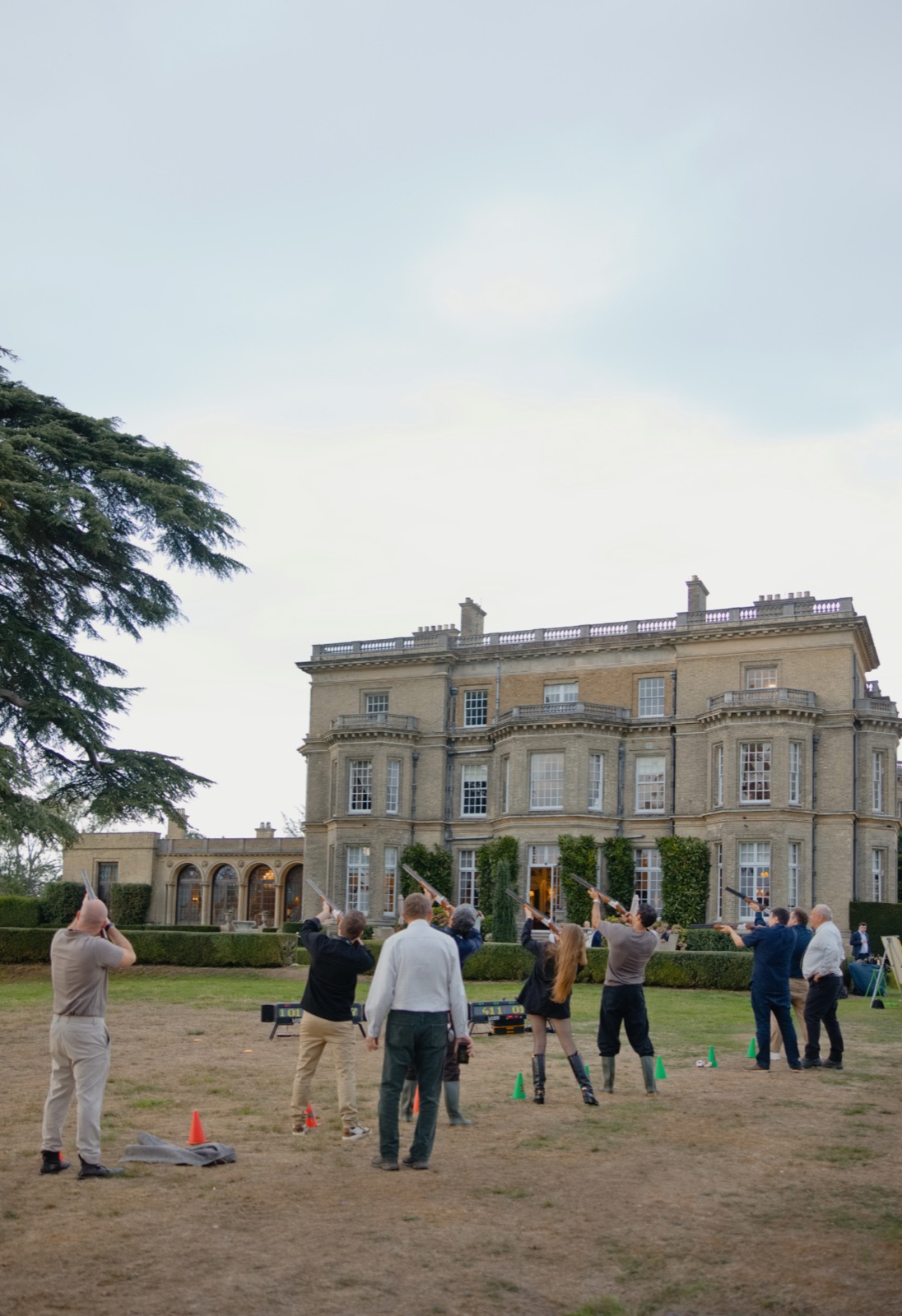 Xenia Tchoumi shooting clays with fellow guests on the lawn in front of Hedsor House during the Golden Hours of The Hedsor Hundred