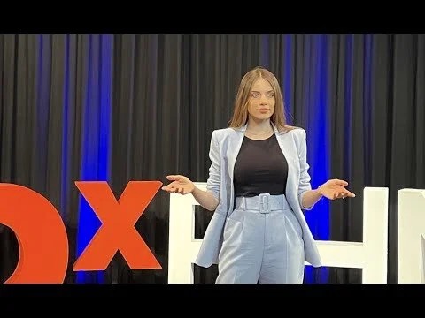 Xenia Tchoumi delivering Physical Connection Is Your Cure at TEDx